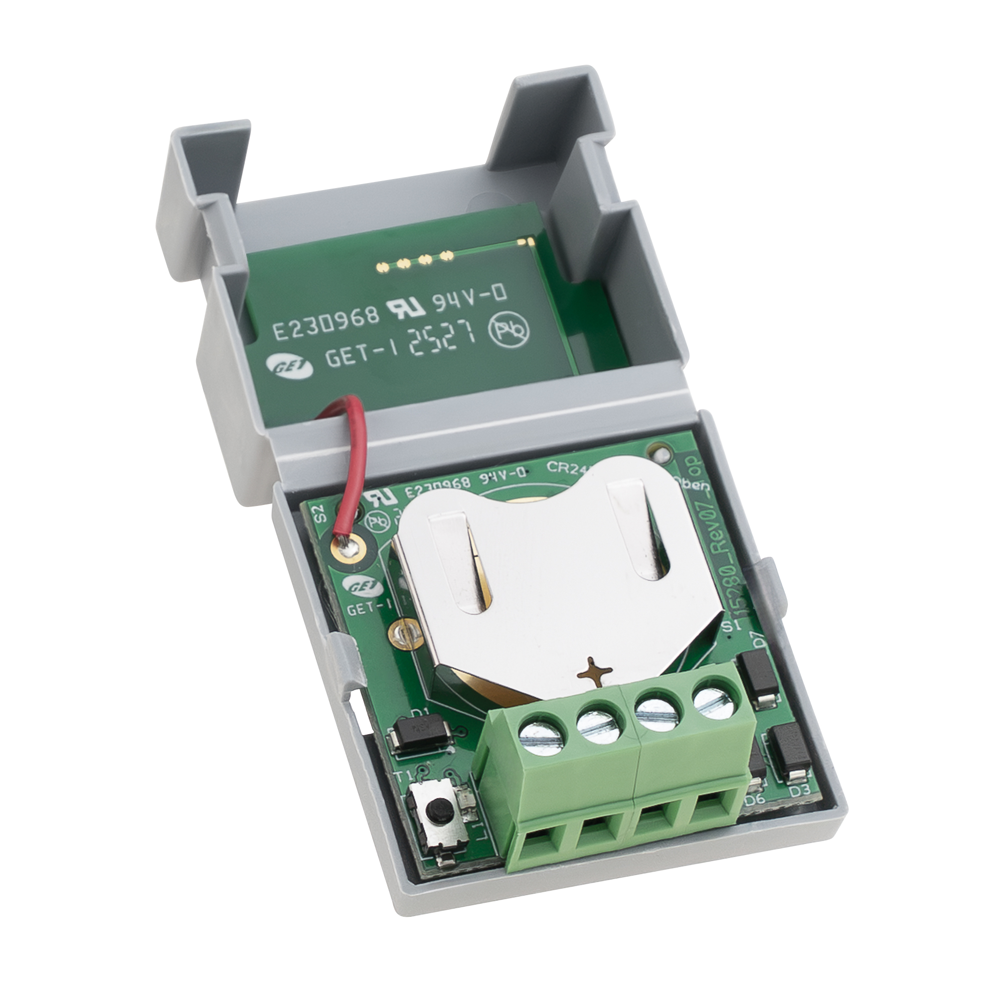 Geöffneter Einbau-Funksender mit sichtbarem Batteriefach, rotem Kabel und grünem Anschlussblock, schräg fotografiert.